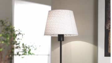 A table lamp on a desk in the hallway