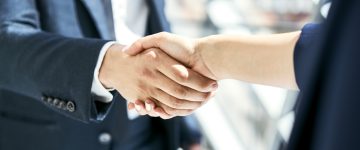 Two people shaking hands.