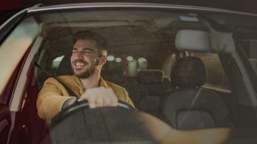 Man in car in parking garage