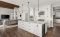 open area white kitchen with recessed lighting