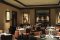 Restaurant with dim lighting controlled by dim-to-warm technology