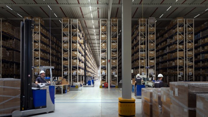 Warehouse staff controlling picking equipment