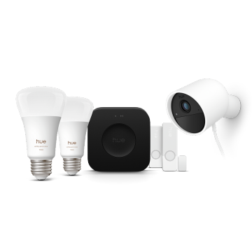 Zwei smarte Philips Hue Lampen, eine Hue Bridge Pro, zwei Hue Kontaktsensoren und eine kabelgebundene Hue Secure Kamera in Weiß. 