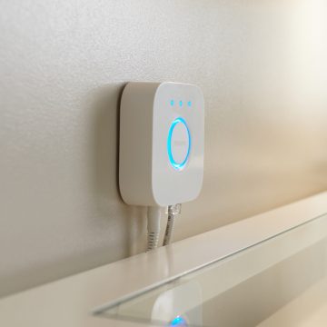 Philips Hue Bridge attached to a wall