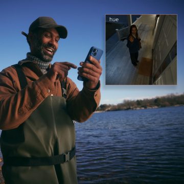 Man and woman checking in on their dog using live view on their mobile