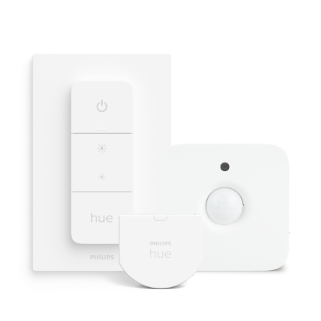 Close up of a Philips Hue smart dimmer switch on white background