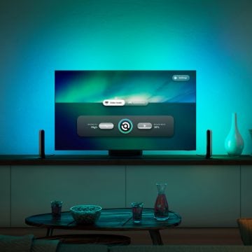TV displaying the Hue Sync TV app with TV backlighting