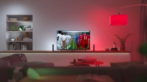 Television with two Philips Hue light bars on either side of tv