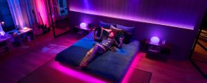 Couple using Amazon Alexa to turn on Philips Hue smart lights