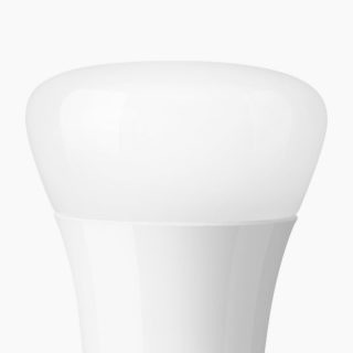 White smart LED bulb with rounded shape and smooth matte finish, no visible switches or ports, shown in close-up.