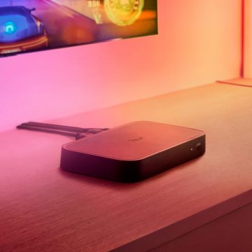 Sync box 8K on TV console in pink and orange light