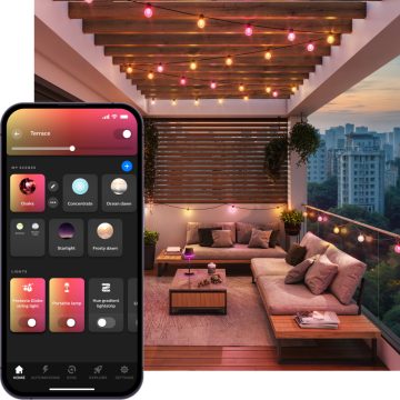 Creëer een sfeervol balkon met Festavia feestverlichting: bolvormige buitenlampen die ’s nachts slim roze en geel licht uitstralen. Perfect voor lange zomeravonden. 